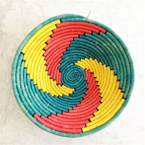 Bright African bowl, hand-woven, large, low bowl with bold pattern in turquoise, red and yellow ...