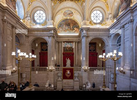 A luxurious Interior of the Royal Palace of Madrid with tourists Stock Photo - Alamy