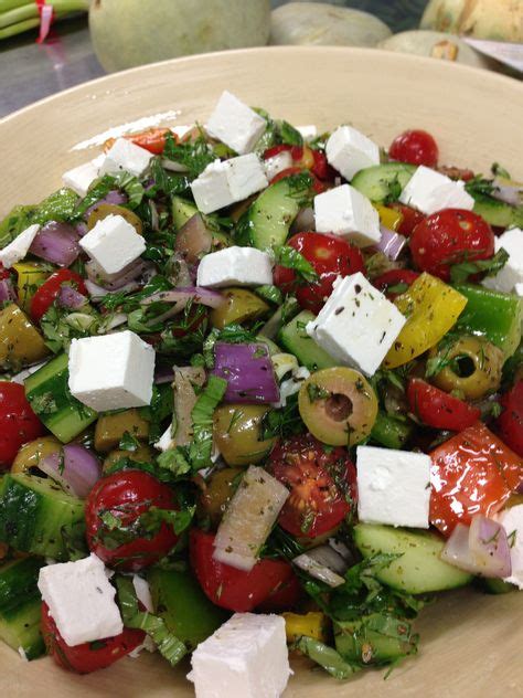 Greek salad - feta cheese, green olives, cherry tomatoes, dried oregano, dried mint, fresh mint ...