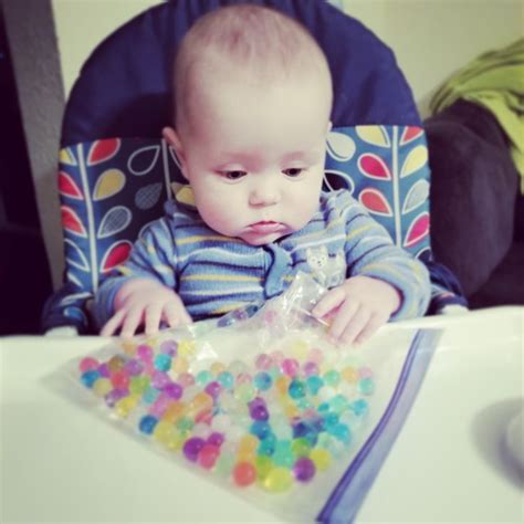 Easy, fun infant sensory activity. Water beads in a taped bag. Put them in the fridge, freezer ...