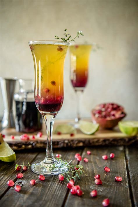 Passion fruit, pineapple, and pomegranate make this fiery Southern Autumn Sunrise Cocktail as ...