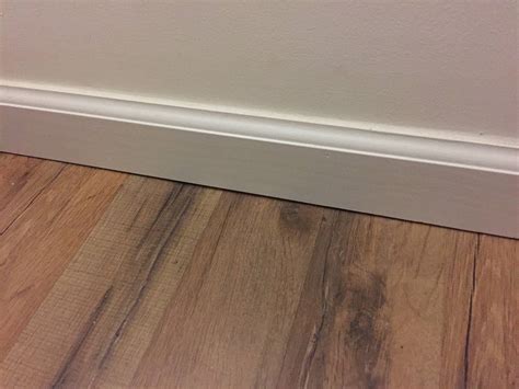 insulation - Easy way to temporarily insulate gap between hardwood floor and baseboard? - Home ...