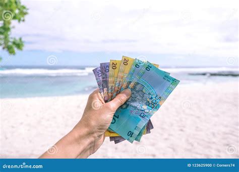 Samoan Tala Currency - Left Hand Holding Bank Notes from Western Stock ...