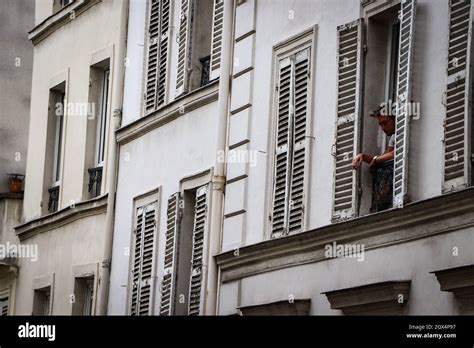 Man smoking out the window in Montmartre, Paris, France Stock Photo - Alamy