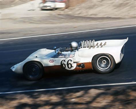 Roger Penske drives his Chaparral 2 through Laguna Seca's famous ...