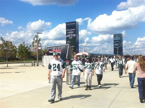 Fans migrate from the parking lot to the stadium | Stadium, Times ...