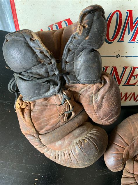 A vintage pair of large brown leather boxing gloves - Belle and Beast ...