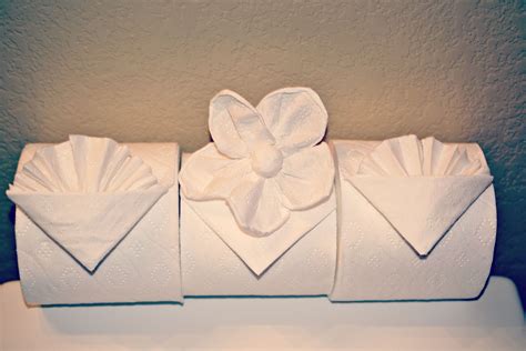 I'm learning toilet paper origami - my bathrooms will never be the same ...