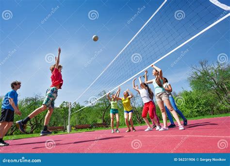 Teenagers Play Volleyball Game On Playing Ground Stock Photo - Image: 56231906