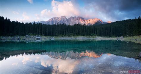 Matteo Colombo Photography | Lake Carezza at sunrise with mountain range reflected Dolomites ...