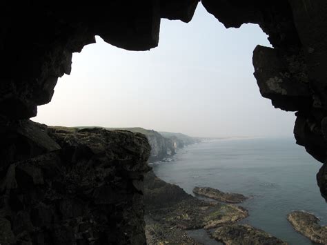 Mermaid’s Cave, a huge sea cove beneath Dunluce Castle rock – Ireland