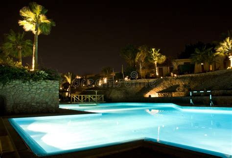 Swimming pool night scene stock image. Image of egypt - 7909401