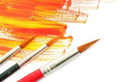 Premium Photo | Abstract gouache paint and brushes isolated on white