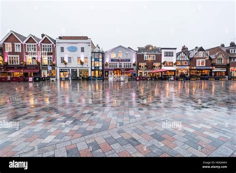 Salisbury Market Square, Wiltshire, UK in December, pre Christmas. Wet with reflection in paving ...