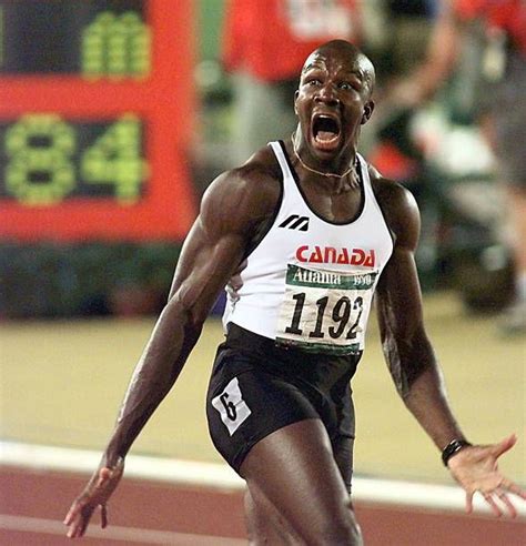 professional athlete celebrates after winning the men's 100m hurdles event