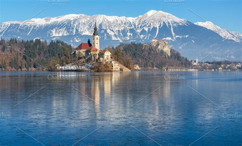 Lake Bled on a frozen winter day ~ Nature Photos ~ Creative Market