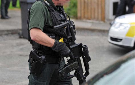 Officer of the Police Service of Northern Ireland with a modified G36.(Belfast, Northern Ireland ...