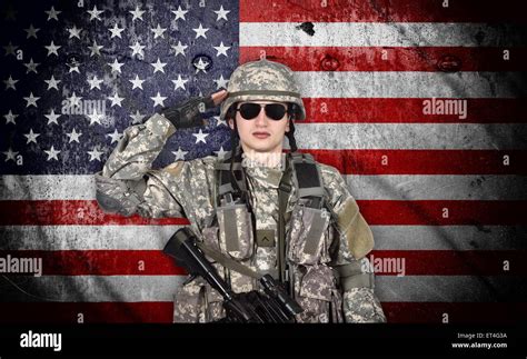 soldier salutes the American flag on the background Stock Photo - Alamy