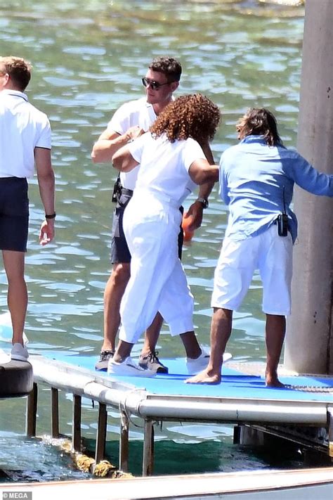 Oprah Winfrey, 69, displays her slimmed-down figure as she arrives by boat to a restaurant on ...