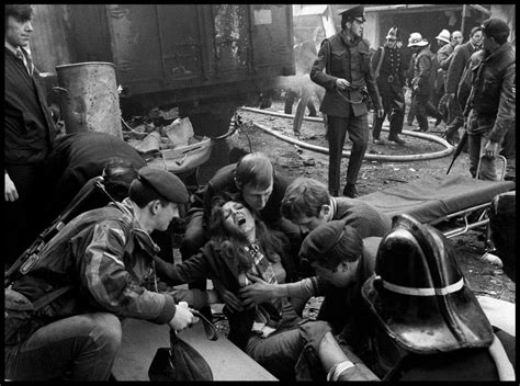 A woman wounded by an IRA bomb explosion in the city centre, is given ...