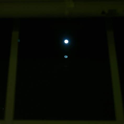 My window created a reflection of the moon : r/mildlyinteresting