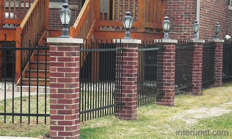 Metal fence with lights on brick pillars picture | interunet