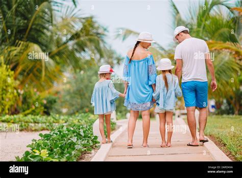 Family of four on summer tropical vacation Stock Photo - Alamy