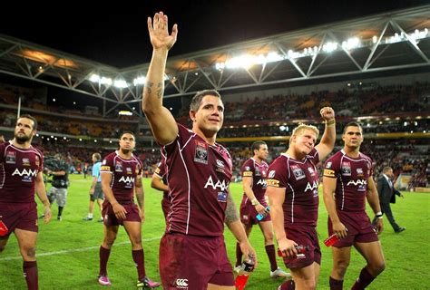 The Maroon Mob: Queensland players celebrate victory in Origin I