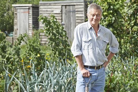 Portrait Of Man Gardening On Allotment | The Social Grabber