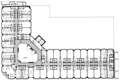 the floor plan for an office building, with several tables and chairs ...