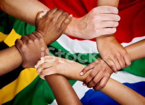 Rainbow Nation Hands Clasped IN Unity Against South African Flag Stock Photos - FreeImages.com