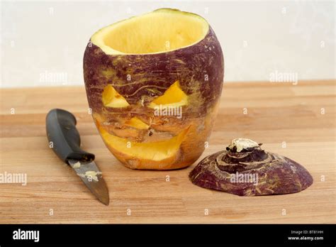 turnip being carved into halloween jack-o-lantern. Traditionally in ...