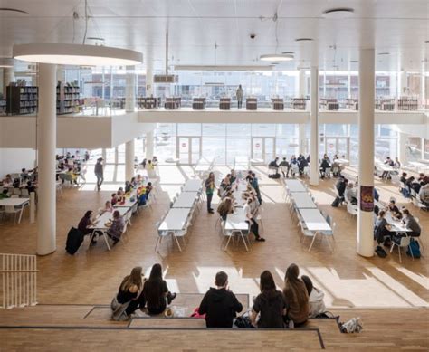 This Danish school is completely covered with over 12,000 sea green solar panels