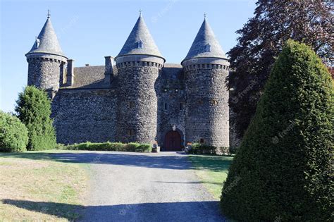 Premium Photo | Located in the heart of the auvergne volcanoes the 1000yearold sailhant castle ...