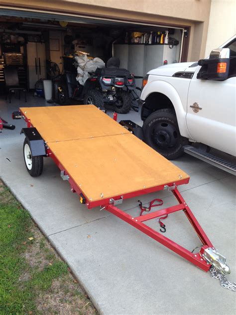 Nice folding trailer solves storage and transportation issues. Found it ...