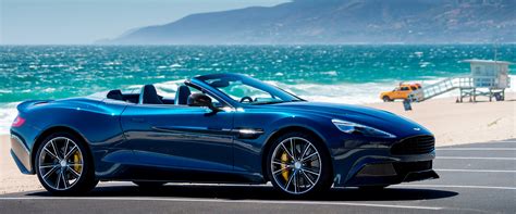 Blue and convertible Aston Martin Vanquish Volante