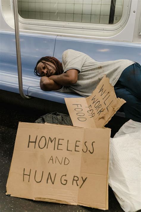 A Homeless Man with Signs · Free Stock Photo