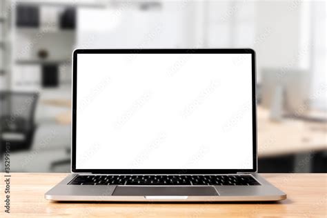 Laptop blank screen on wood table with modern workplace office room ...