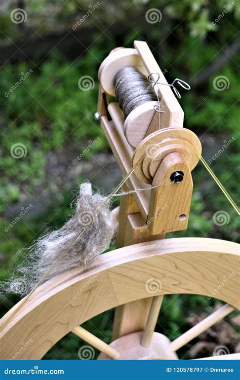 Closeup of Spinning Wheel and Bobbin Filled with Linen Stock Image - Image of green, fiber ...