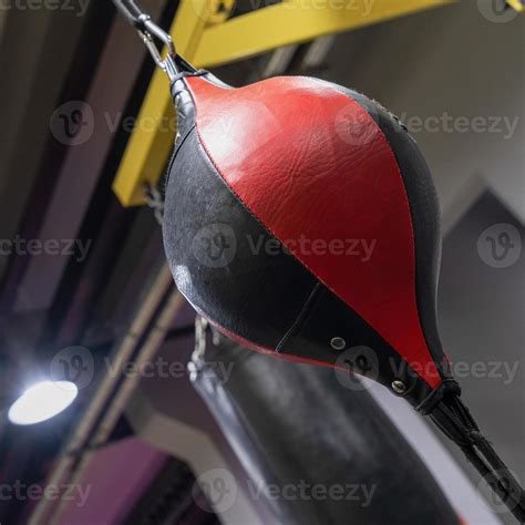 A vertical closeup of a boxing punching bag in the sports complex ...