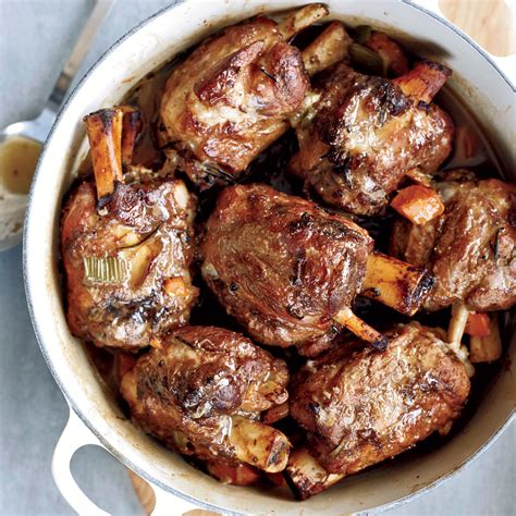 a pot filled with meat and vegetables on top of a table