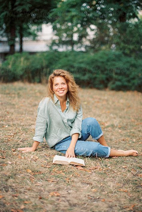 woman with a book in a park - Stock Image - Everypixel