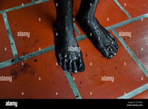 Mud covered feet hi-res stock photography and images - Alamy