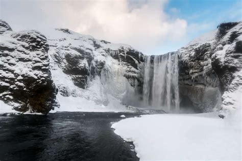 Frozen Skogafoss waterfall during winter in Iceland | I am Reykjavik