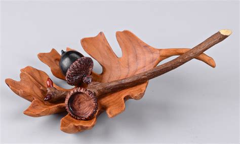 Flowers and leaves carved in wood. Nature wood carvings