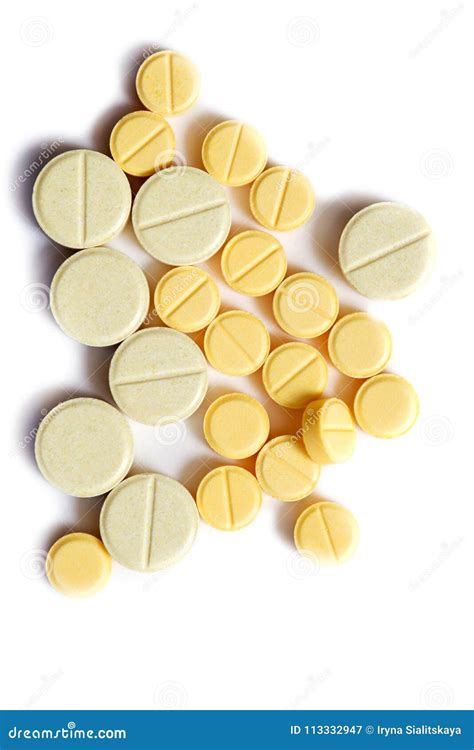 Closeup of Yellow Tablet on Isolated White Background. Tablets of ...