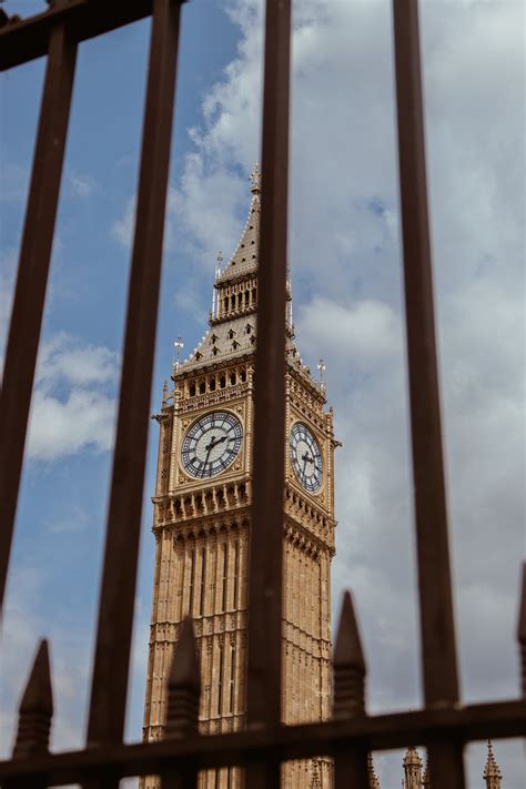 Low Angle View of Clock Tower Against Blue Sky · Free Stock Photo