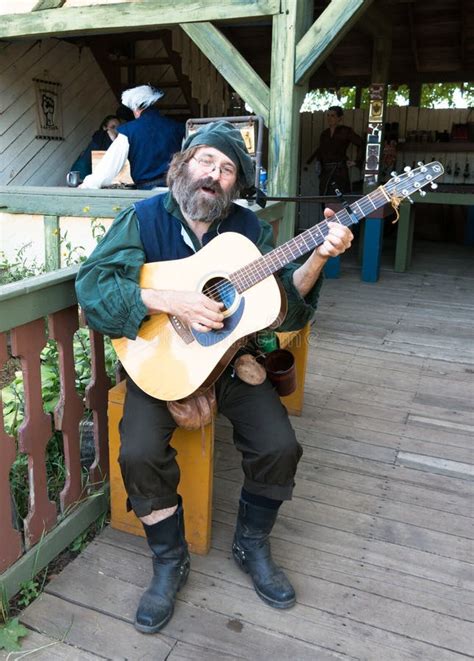 A Man in Troubadour Costume Plays Guitar at Renaissance Festival Editorial Stock Image - Image ...