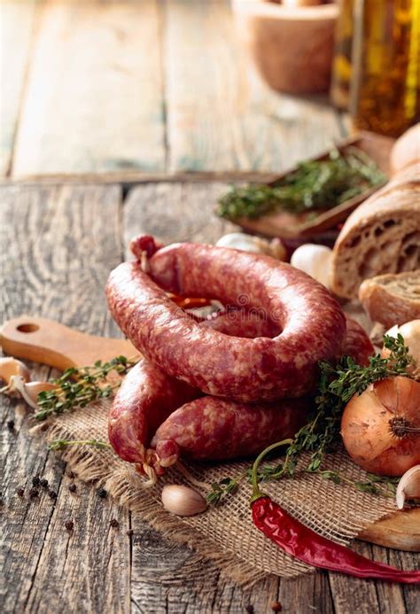 Dry-cured Sausage with Bread and Spices on a Old Wooden Table Stock Photo - Image of salami ...