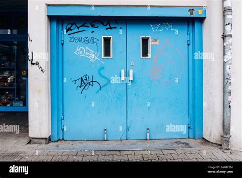 Painted door to the garage. Old doors in the garage Stock Photo - Alamy